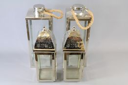 A Pair of Chrome Floor Lanterns