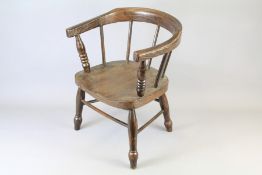 A Stained Oak Child's 'Smoking Chair'