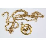 A 9ct Gold Zodiac Capricorn Pendant and Chain
