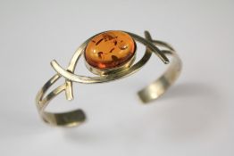 A Ladies Silver and Amber Bangle