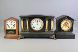 A Glass-Fronted Mantel Clock.