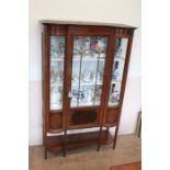 An Edwardian Curved Glass Display Cabinet