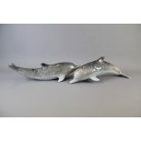 A Pair of Silver-Grey Glazed Porcelain Dolphins
