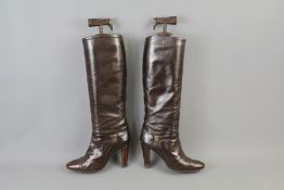 A Pair of Gucci Calf Length Boots