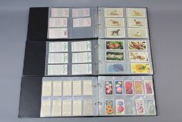 A Quantity of Cigarette Cards and Postcards