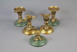 A Set of Four Classical-Style Candle Holders