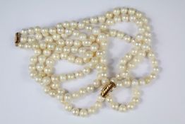 A Triple Strand Cultured Pearl Necklace