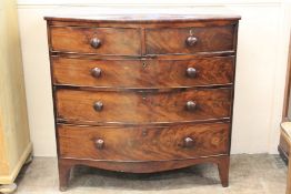 A Bow-Fronted Flame Mahogany Chest of Drawers