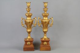 A Pair of Gold-Painted Clock Garniture