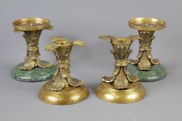 A Set of Four Elegant Classical-Style Candle Holders