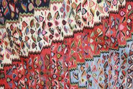 An Antique Persian Wool Carpet