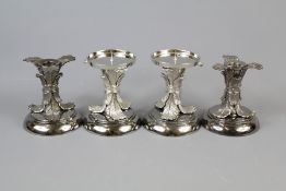 A Set of Four Black Nickel Candle Holders