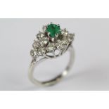 A 14ct White Gold Emerald and Diamond Ring
