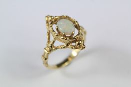 A Continental 14ct Yellow Gold and Opal Ring