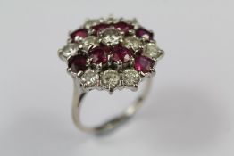 An 18ct Gold Ruby and Diamond Cluster Dress Ring