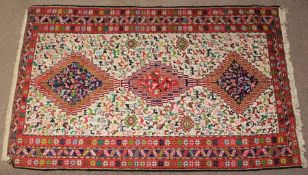 An Antique Persian Wool and Silk Carpet