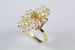 A Continental 14ct Yellow Gold and Seed Pearl Floral Ring