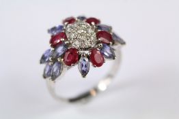 An 18ct White Gold Ruby Diamond and Sapphire Ring