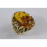 A Gentleman's Bespoke 18ct Yellow Gold and Amber Ring
