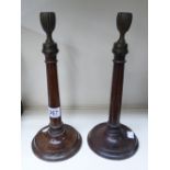PAIR OF MAHOGANY & BRASS CANDLE STICKS 32 CMS HIGH