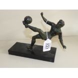 BRONZED SPELTER FIGURE OF A FOOTBALLER ON A MARBLE STAND 16 CMS HIGH