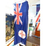 BLUE ENSIGN WITH ADDED EMBLEM ( LABEL READS P.L.STONEWALL AUSTRALIA) 92 X 182 CMS
