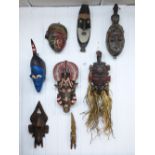 8 CARVED AFRICAN MASKS