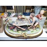 CAPODIMONTE FIGURAL GROUP OF CHILDREN PLAYING CARDS 'THE CHEAT' BY BRUNO MERLI