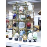 COLLECTION OF DECORATIVE EGGS + GLASS BACKED DISPLAY STAND