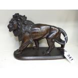 BRONZED SPELTER FIGURE OF A LION SIGNED, COINCHON 16 X 22 CMS