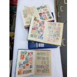 QUANTITY OF POSTAGE STAMPS IN 4 ALBUMS