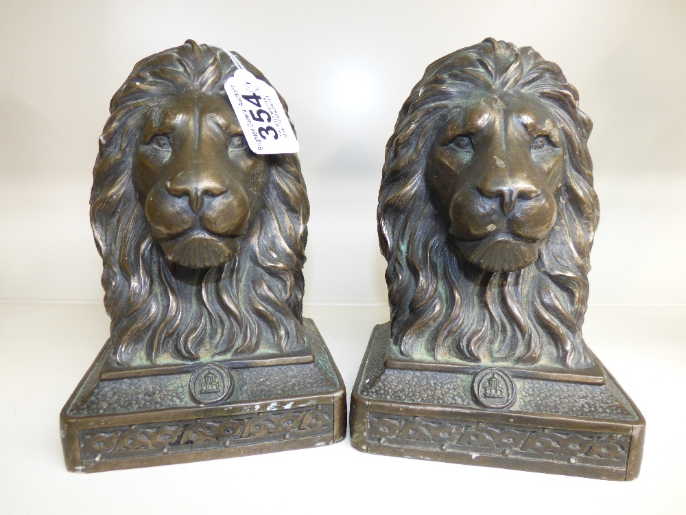 PAIR OF LION HEAD BOOKENDS / DOORSTOPS 19 CMS HIGH