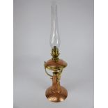 ARTS AND CRAFTS COPPER AND BRASS OIL LAMP WITH BEATEN BODY OF INVERTED TRUMPET FORM WITH BOWL AND