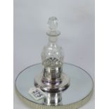 CUT GLASS BOTTLE IN A HALL MARKED SILVER STAND