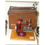 CASED SEWING MACHINE