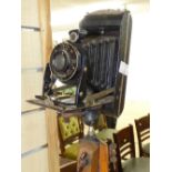 VINTAGE KODAK JUNIOR CAMERA ON WOODEN TRIPOD