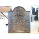 ANTIQUE CAST IRON FIRE BACK ARCHED TOP & DECORATED WITH DOVES & CHERUBS 80 CMS WIDE & 94 CMS AT