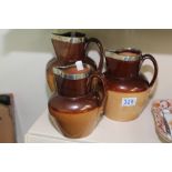 SET OF 3 GRADUATED STONEWARE JUGS WITH SILVER RIMS