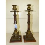 PAIR OF REGENCY STYLE MAHOGANY & BRASS CANDLESTICKS