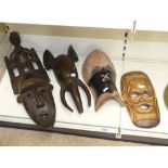 4 CARVED AFRICAN MASKS