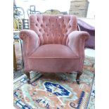 PINK UPHOLSTERED ARMCHAIR