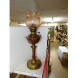 CONVERTED BRASS & COPPER OIL LAMP WITH PEACH GLASS SHADE