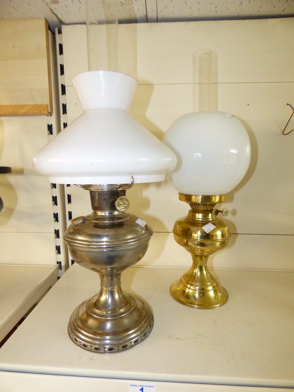 2 X OIL LAMPS, 1 X BRASS & 1 X WHITE METAL BASED