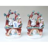 PAIR OF STAFFORDSHIRE FIGURE GROUPS, FIGURES ON BRIDGES OVER SWANS 20 CMS