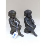PAIR OF BRONZE FIGURES OF SEATED CHILDREN 15 CMS