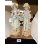 A PAIR OF EARLY 20TH CENTURY BISQUE CERAMIC FIGURES OF A LADY & GENTLEMAN (APPROX 36CM)