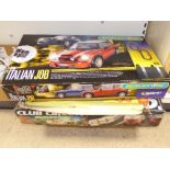 TWO BOXED SCALEXTRIC SETS AND A PLAYCRAFT CHAMPION MOTOR RACING SET