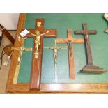 TWO BRASS CRUCIFIX AND THREE WOOD AND METAL FIGURES