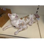 A FRENCH FAIENCE CERAMIC WALL POCKET FIGURE OF A CAT BY GEO MARTEL. 49 CM IN LENGTH.