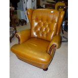 BROWN BUTTONED LEATHER WING BACK ARM CHAIR